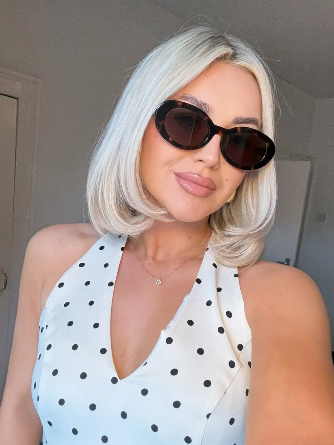 beachy summer blonde hair color 2026 Polished Platinum Bob With Vintage Glam Finish