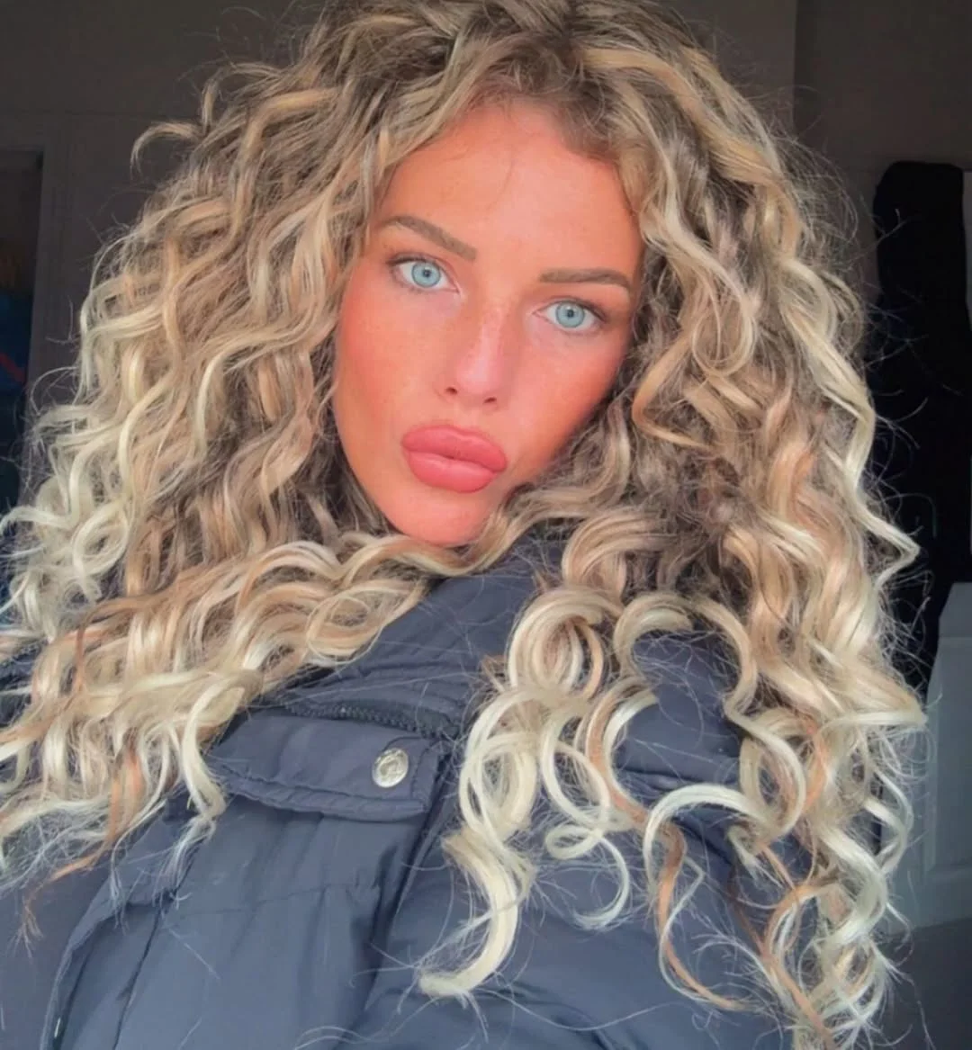 beachy summer blonde hair color 2026 Golden Blonde Spiral Curls With Sunlit Dimension