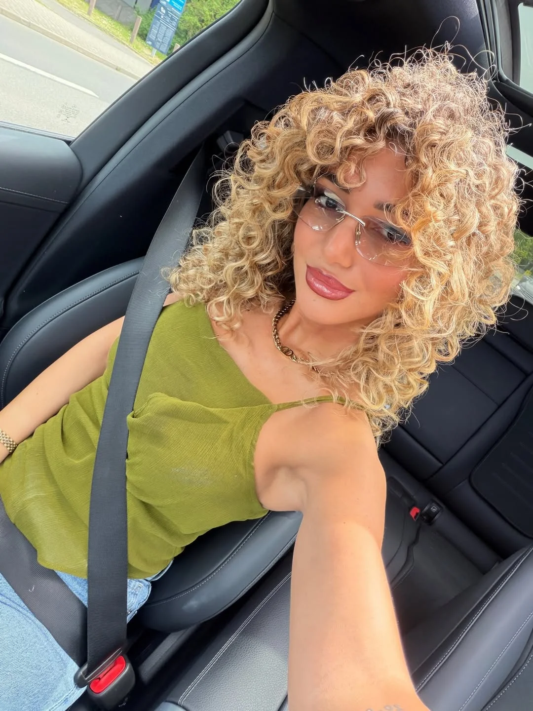 beachy summer blonde hair color 2026 Honey Blonde Corkscrew Curls With Playful Volume