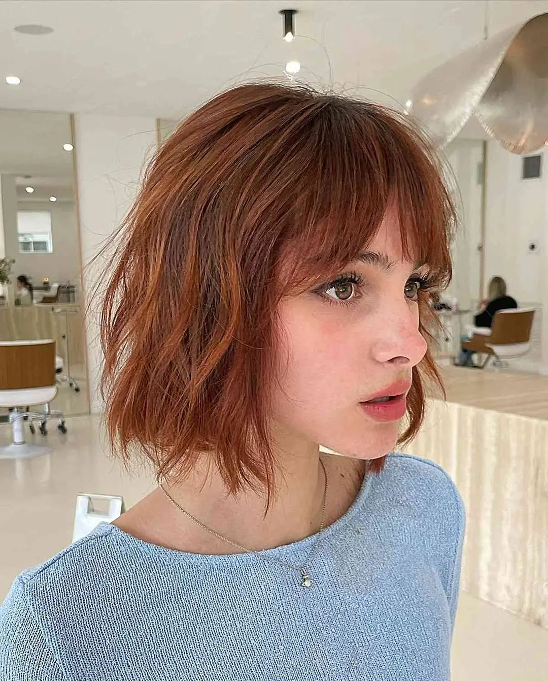 21 choppy summer bob haircut 2026 Light Layered Bob With Soft Curtain Movement