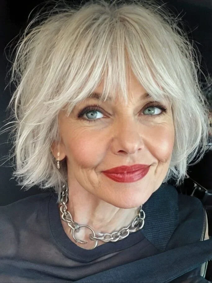 classy summer haircuts for women over 60 2026 Soft Short Wavy Bob with Wispy Bangs