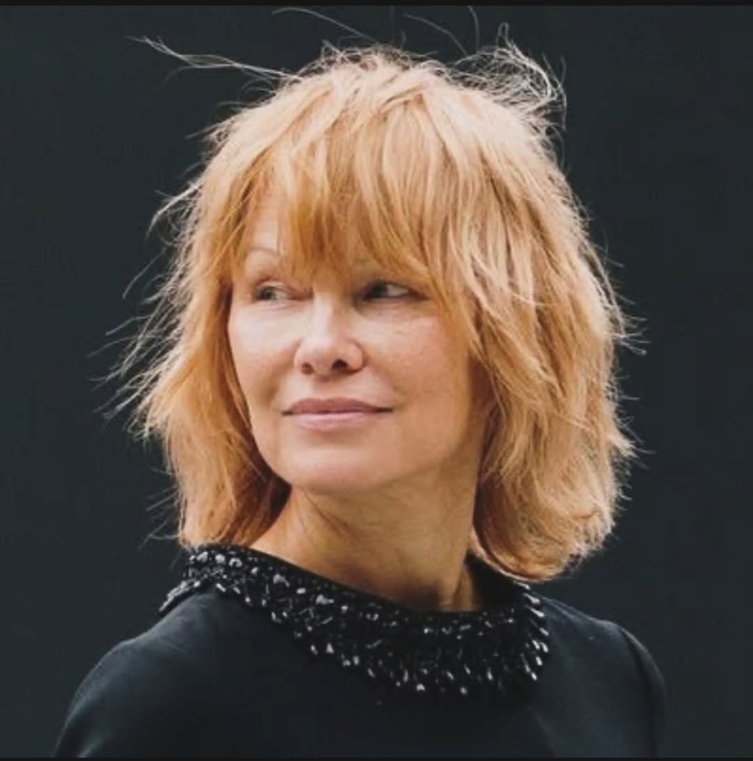 elegant summer haircuts for women over 50 2026 Soft Long Shag with Feathered Bangs