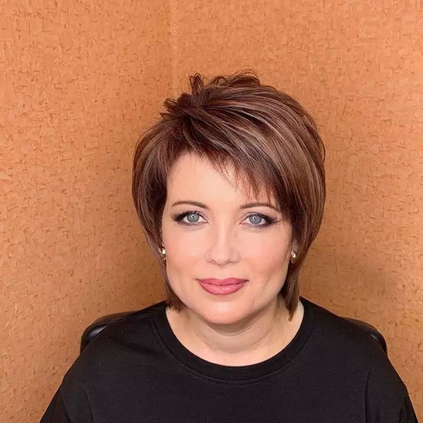 elegant summer haircuts for women over 50 2026 Sassy Layered Wedge Pixie