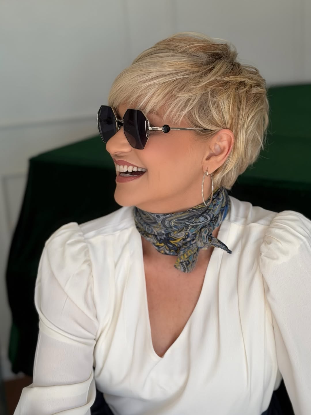 elegant summer haircuts for women over 50 2026 Textured Blonde Pixie with Long Layers