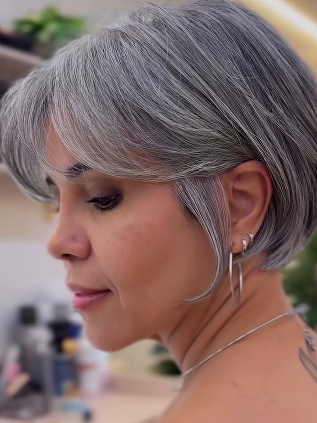 elegant summer haircuts for women over 50 2026 Short Stacked Bob with Side Bangs