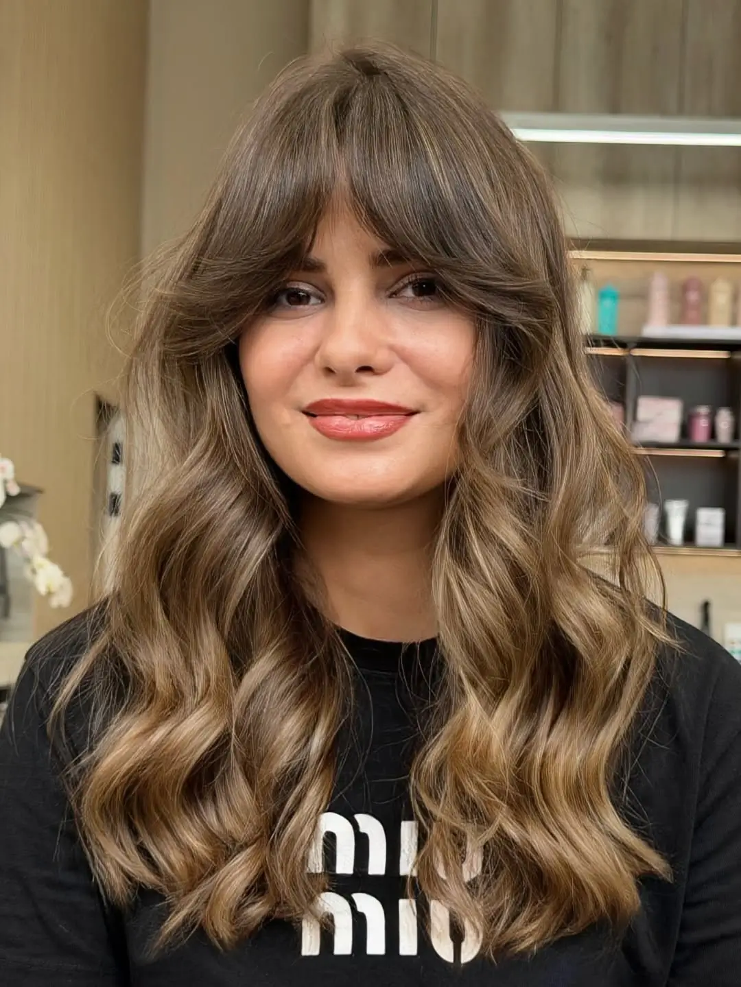face framing summer haircuts for long hair 2026 Soft Brunette Waves with Feathered Curtain Bangs