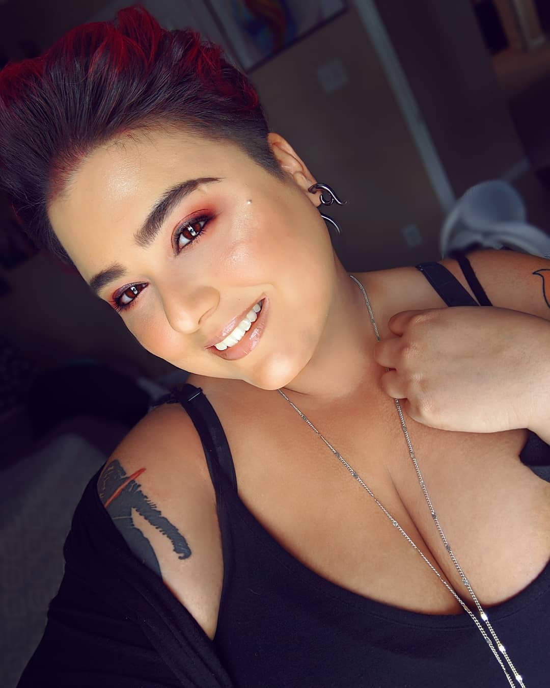 face-framing summer haircuts for plus size women 2026 Bold Undercut Pixie with Brushed-Up Volume