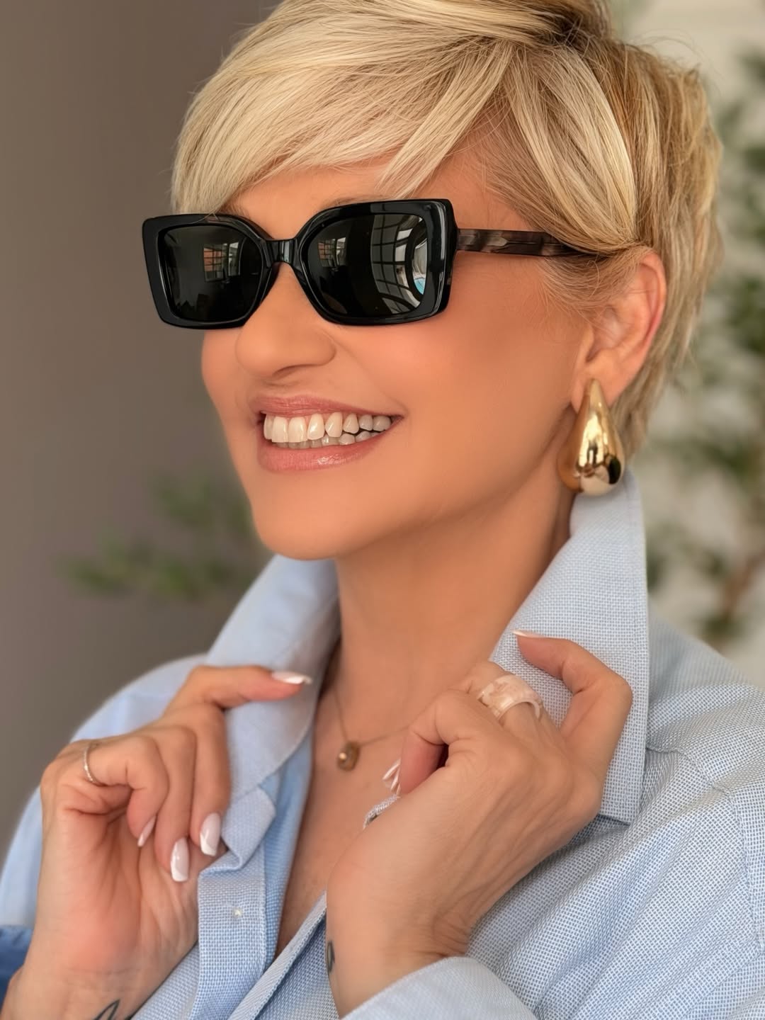 face-framing summer haircuts for plus size women 2026 Chic Layered Blonde Pixie with Side Sweep