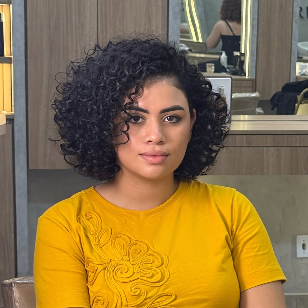 face-framing summer haircuts for plus size women 2026 Short Curly Bob with Deep Side Part