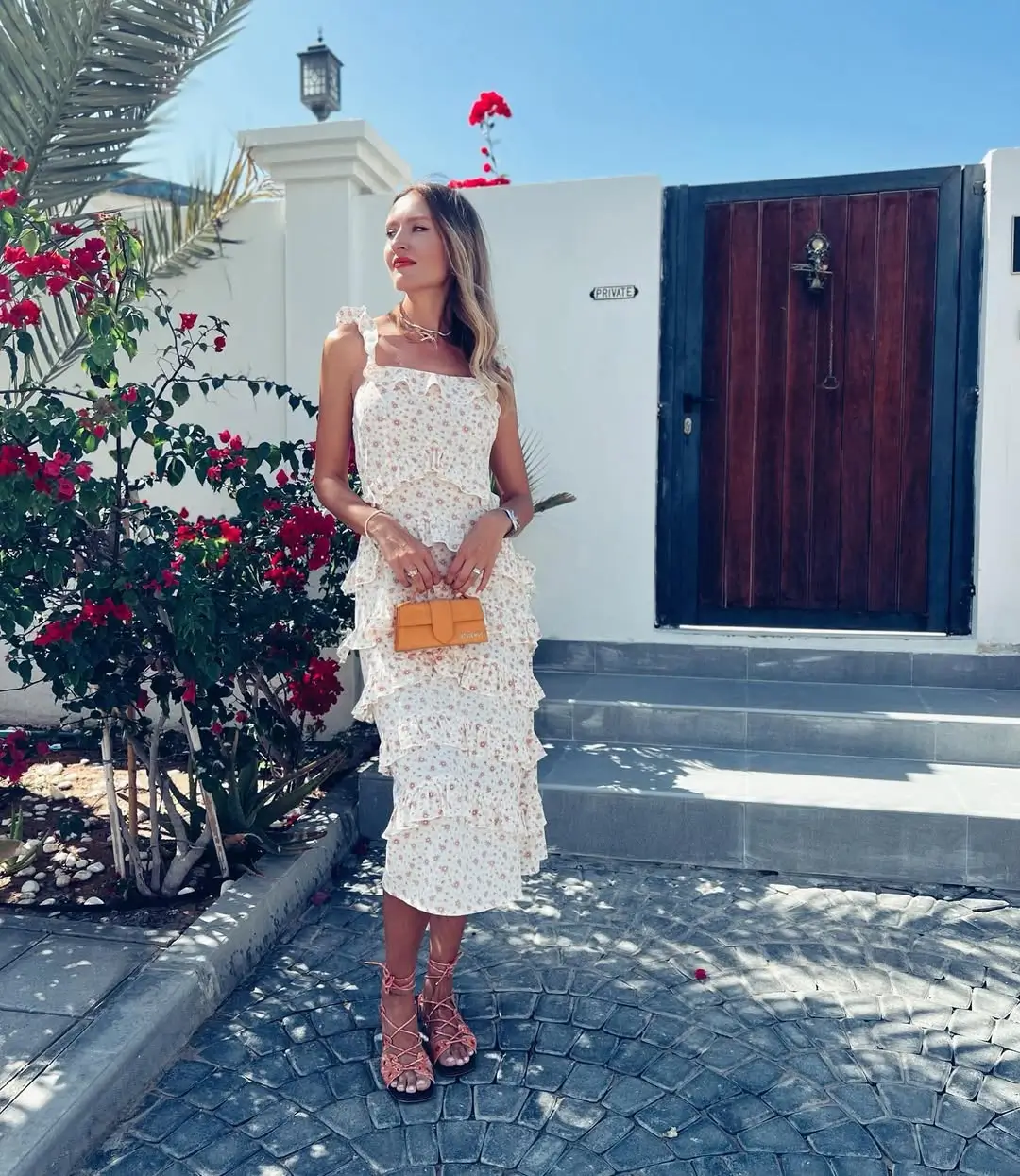 24 floral summer sleeveless dresses 2026 Soft white midi floral dress with layered romantic details