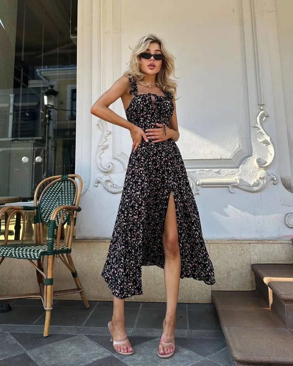 24 floral summer sleeveless dresses 2026 Chic black midi floral dress with a subtle slit detail