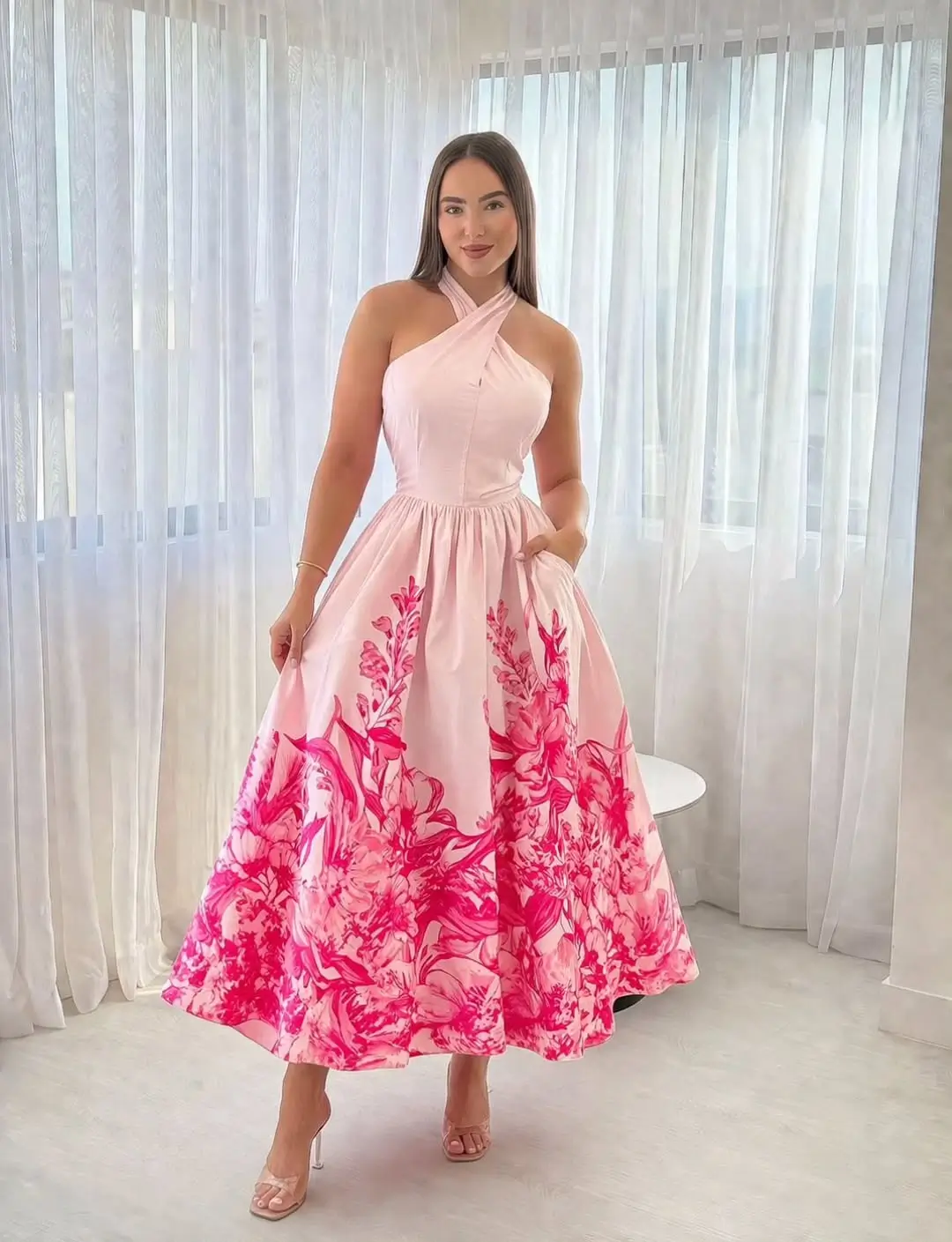 24 floral summer sleeveless dresses 2026 Structured pink midi floral dress with bold artistic print
