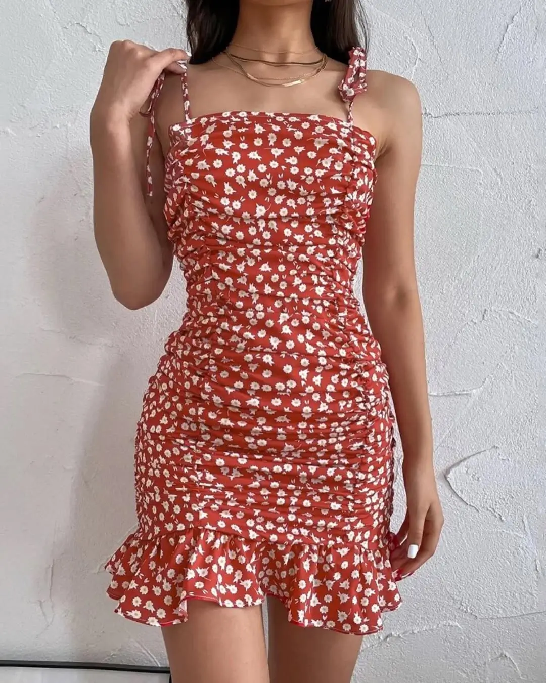 24 floral summer sleeveless dresses 2026 Playful red short ruched floral dress with flirty volume