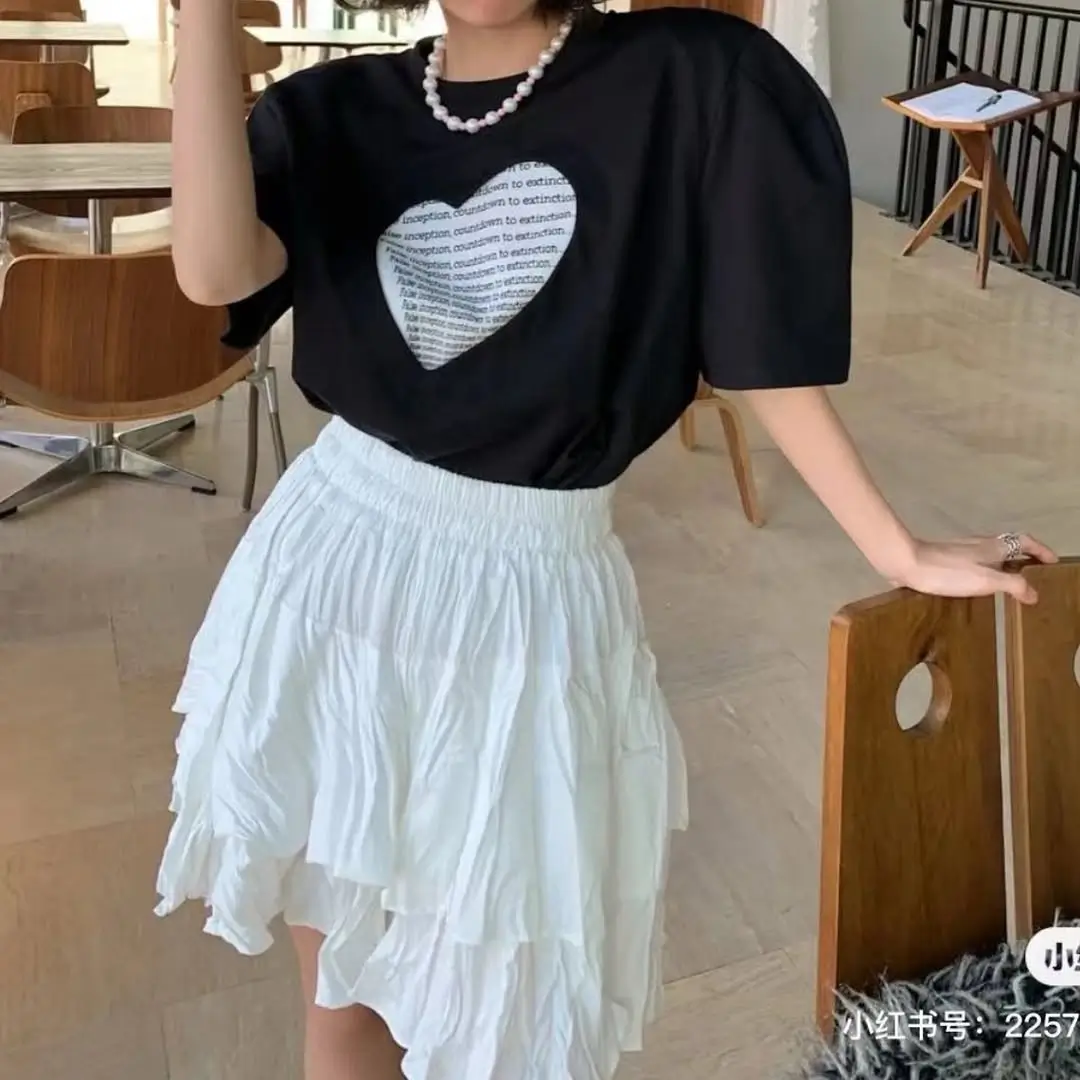 21 flowy summer skirt outfits 2026 Soft White Short Skirt With Graphic Black Tee