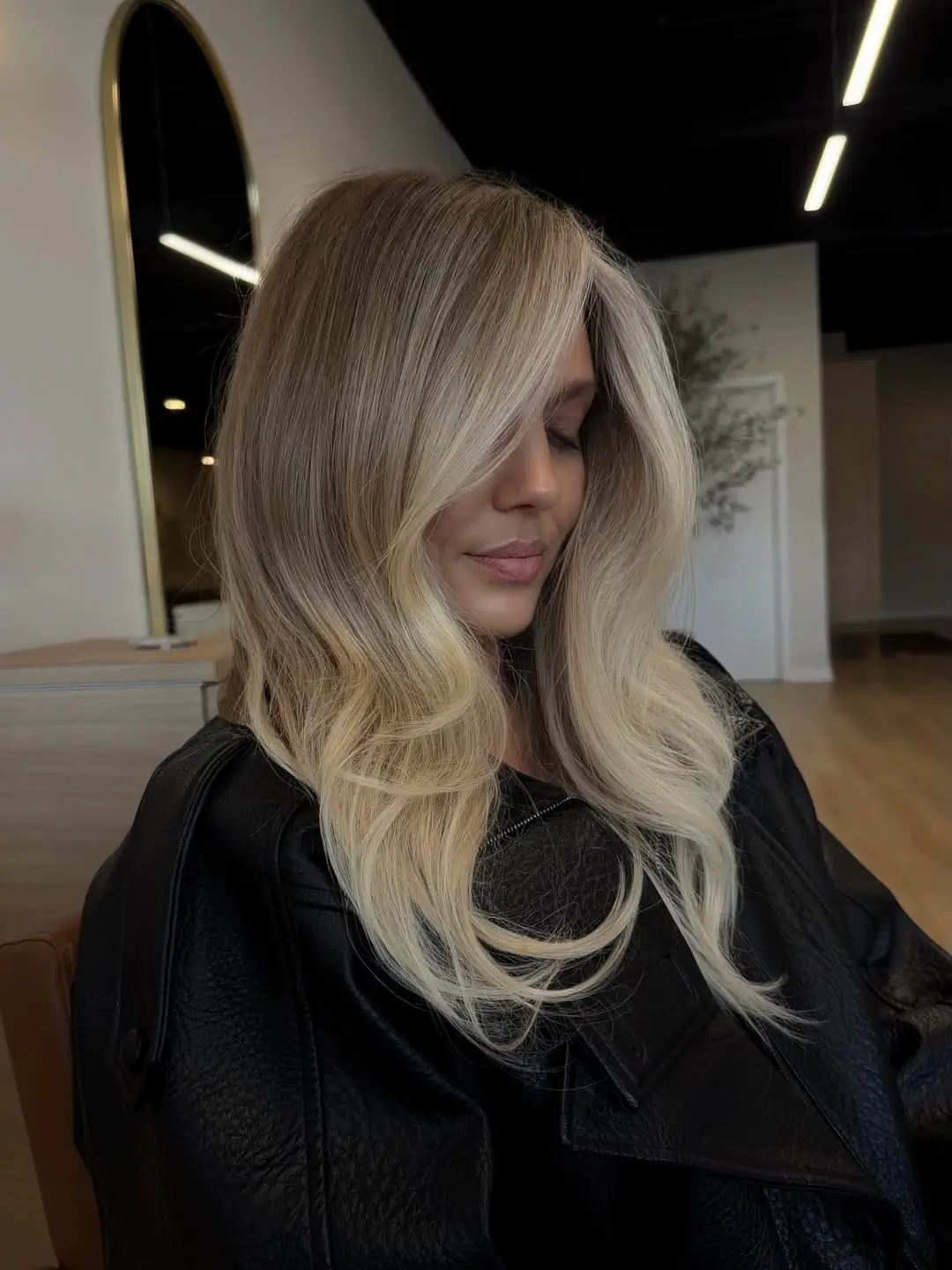 fresh summer haircut 2026 Cool Toned Blonde Layers With Soft Face Curtain