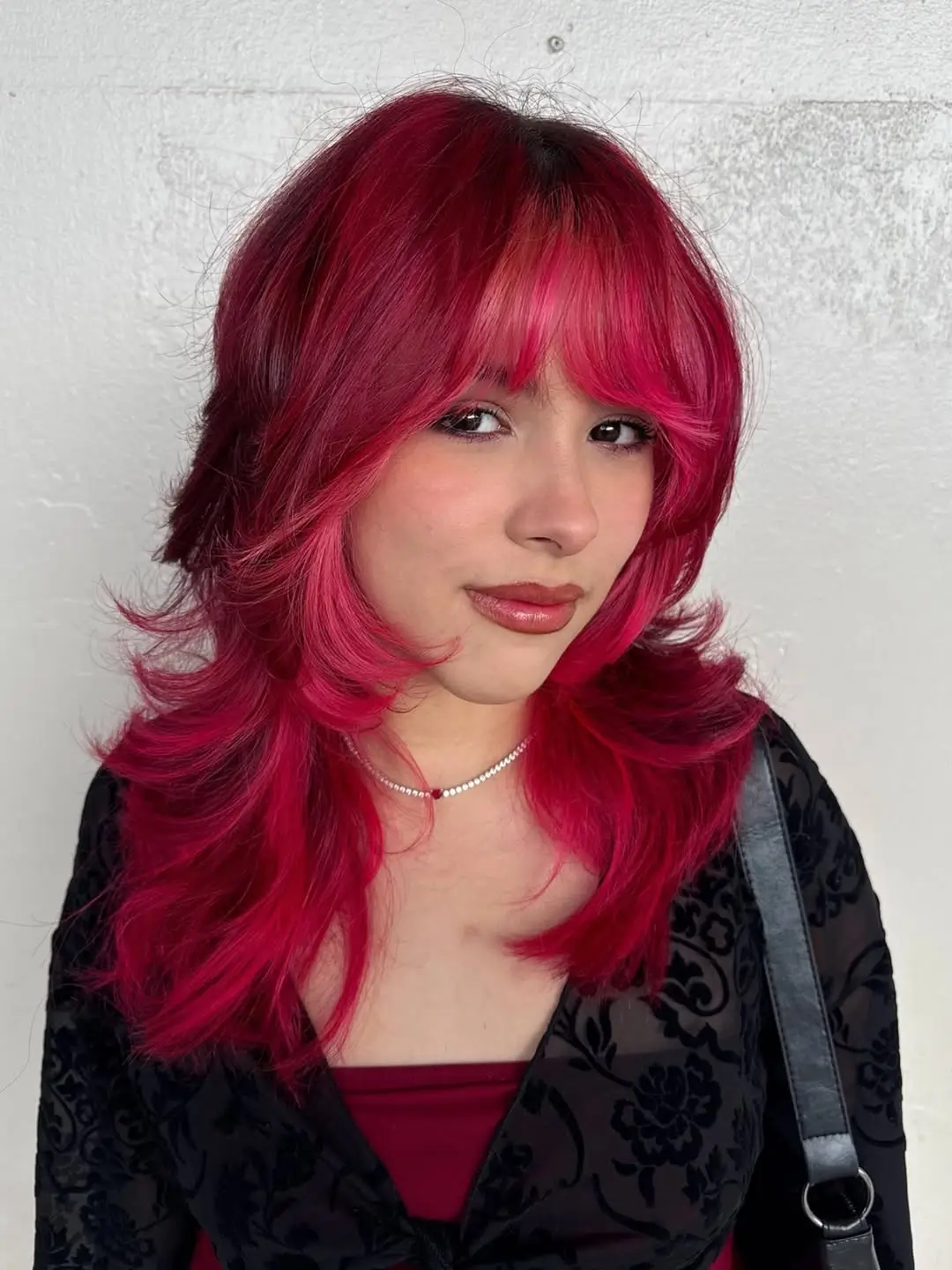 fresh summer haircut 2026 Bold Cherry Red Layered Shag With Full Bangs