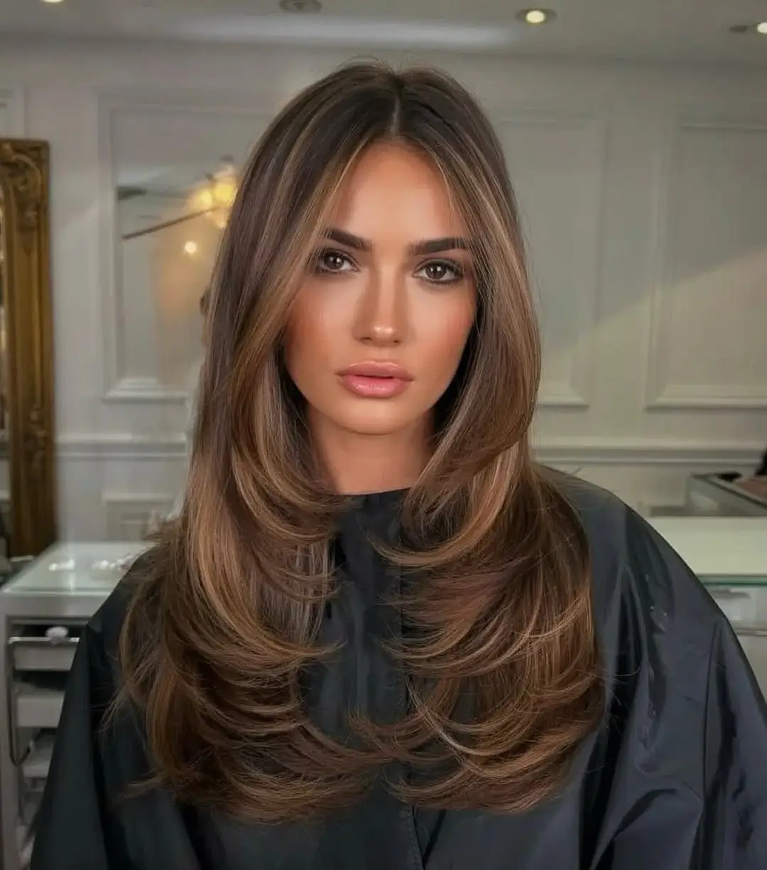 fresh summer haircut 2026 Polished Layered Blowout With Soft Curtain Movement