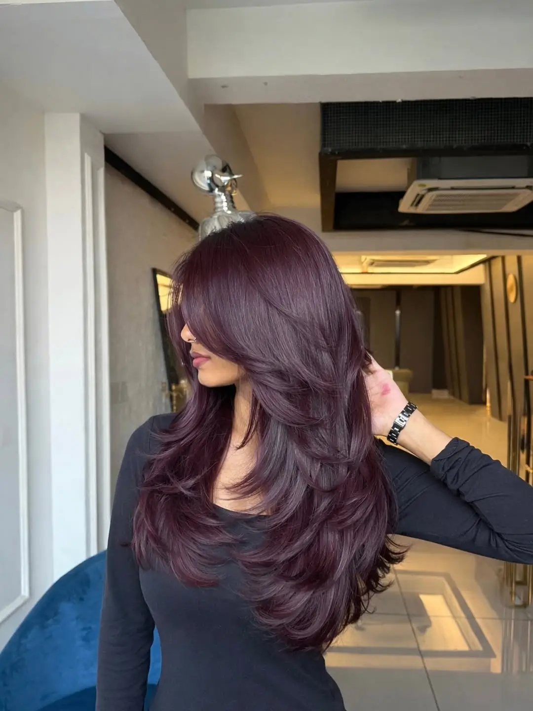 fresh summer haircut 2026 Deep Burgundy Layered Waves With Volume