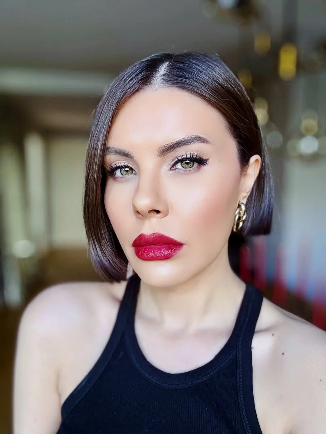 modern summer haircuts for women over 40 2026 Sleek Glass Bob With Deep Side Part