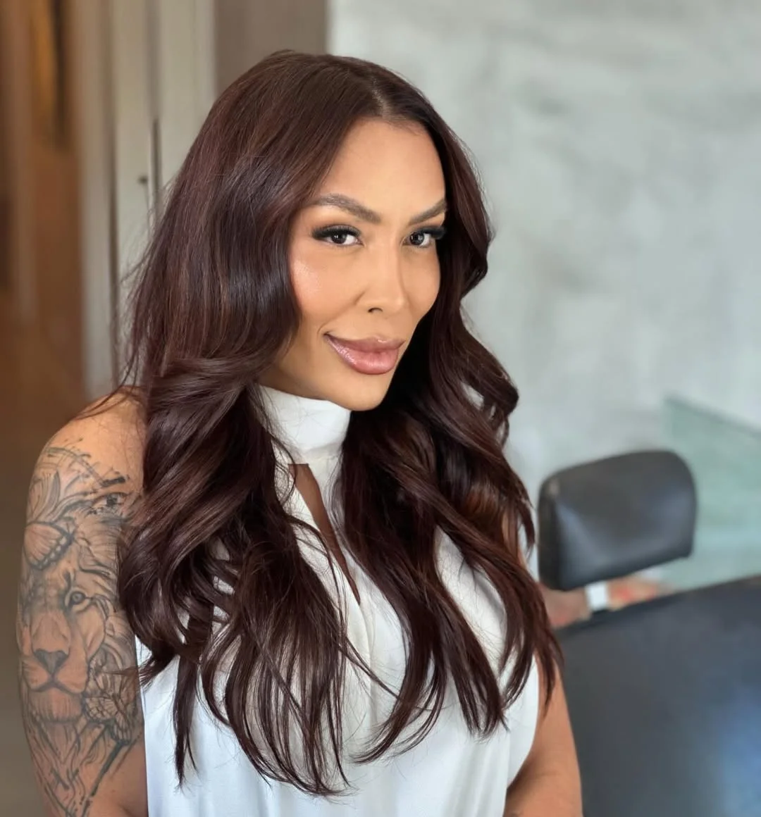modern summer haircuts for women over 40 2026 Soft Layered Waves With Deep Auburn Dimension