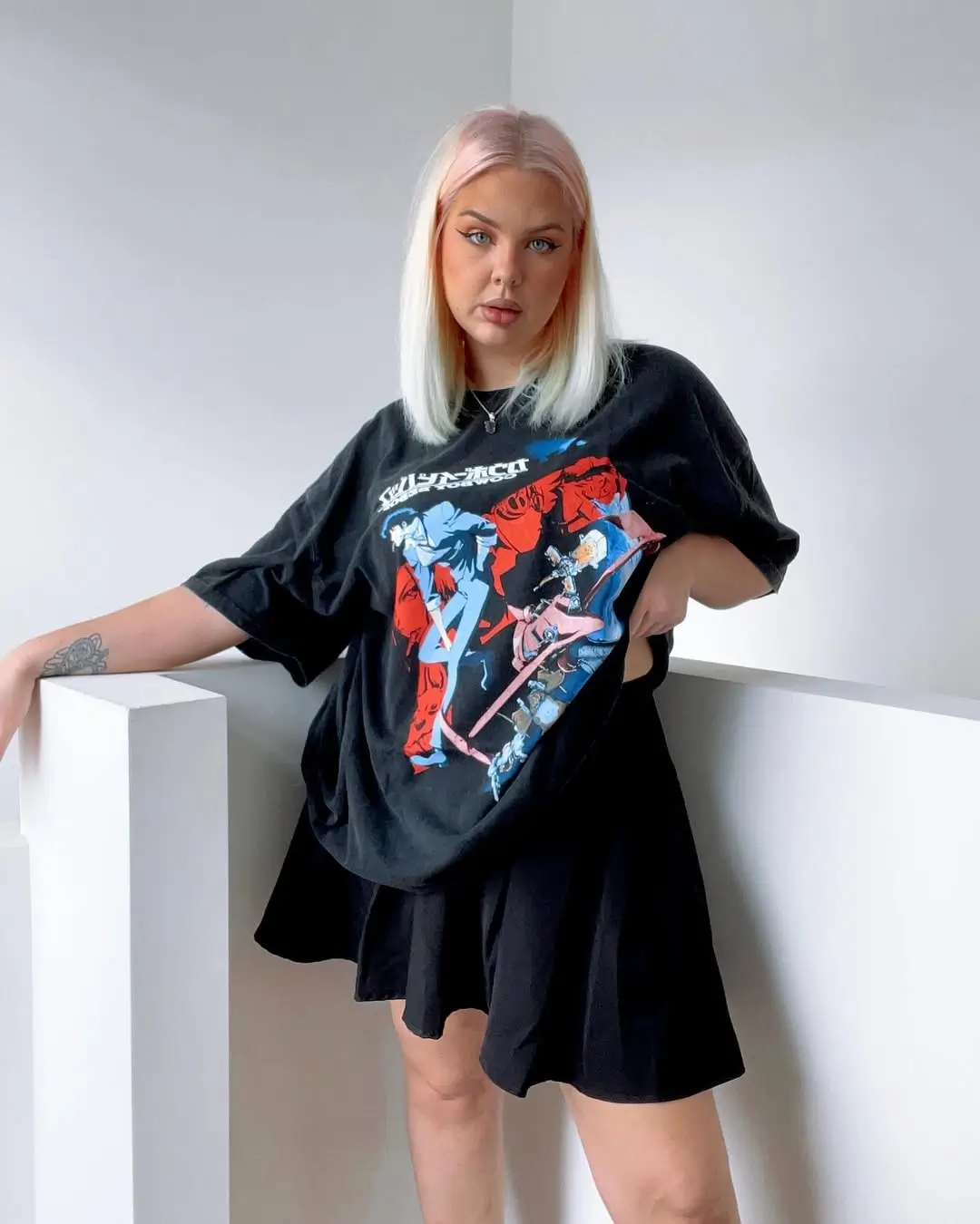 25 oversized summer outfit 2026 Oversized graphic tee styled with a mini skirt for edgy balance