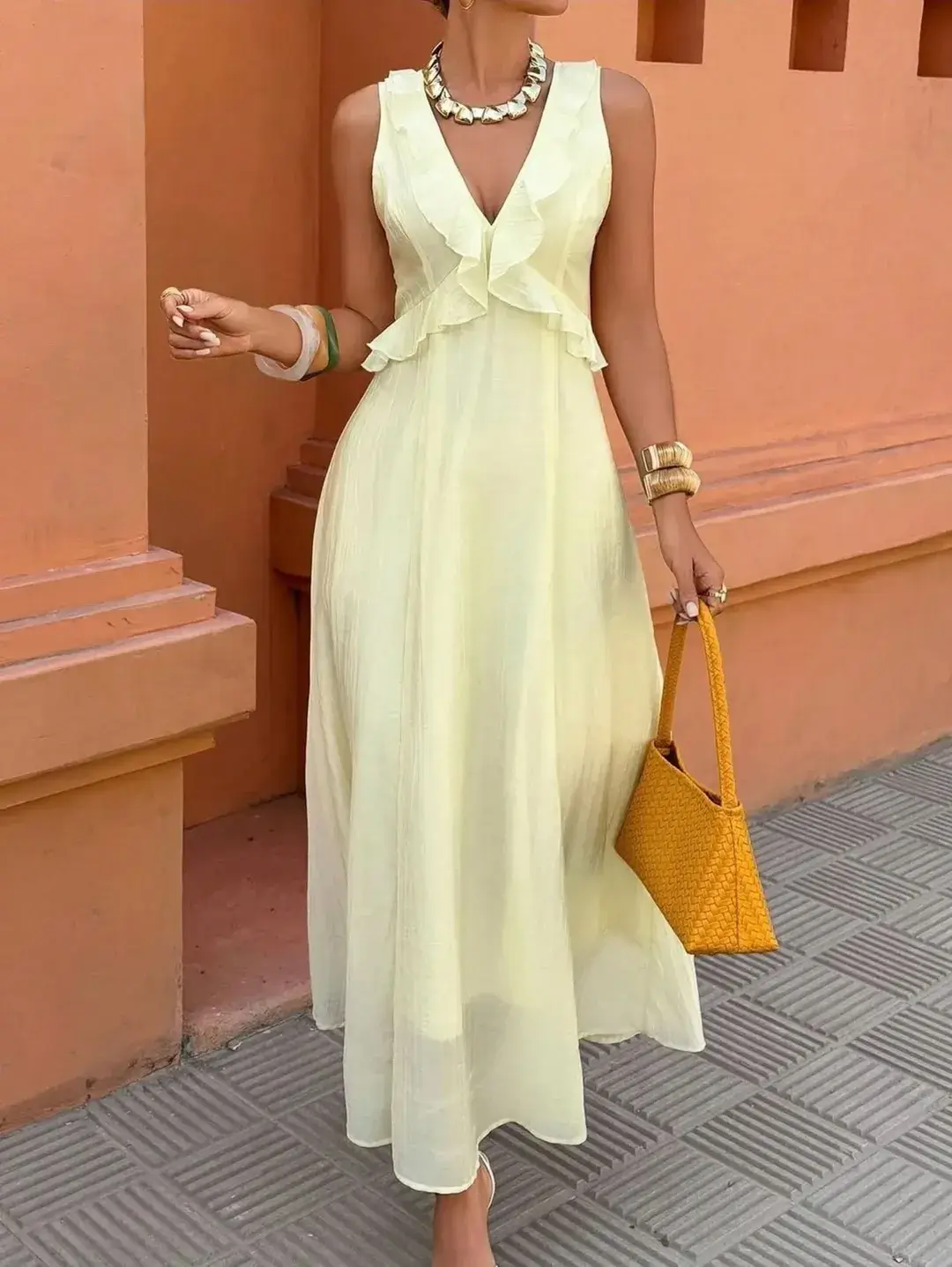 24 summer sleeveless dresses 2026 Soft Yellow Flowing Dress with a Romantic Touch