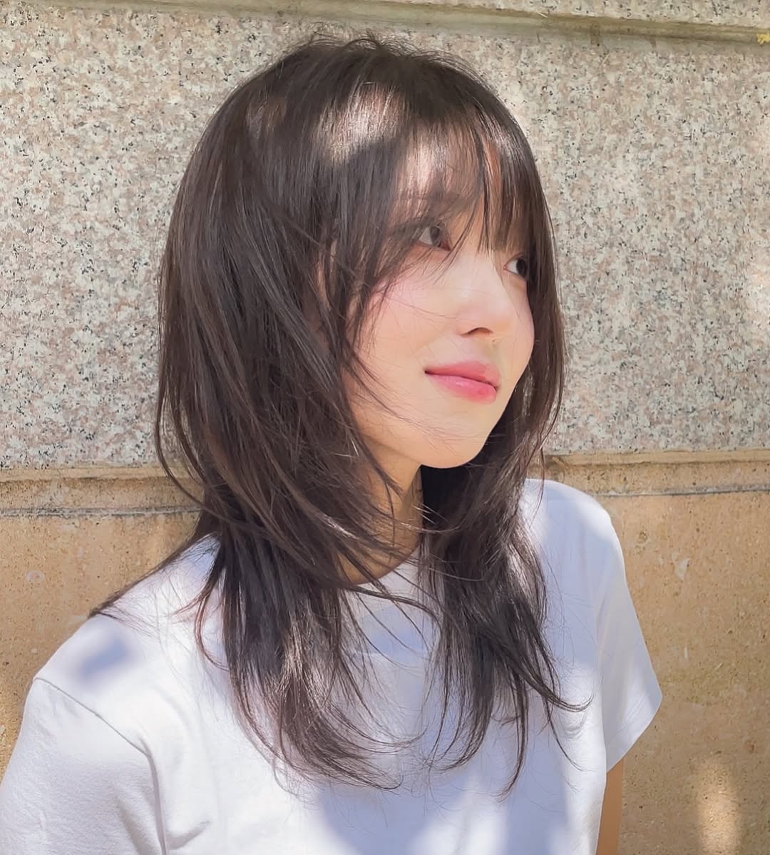 textured summer haircuts for medium hair 2026 Soft Layered Korean Inspired Cut with Wispy Bangs