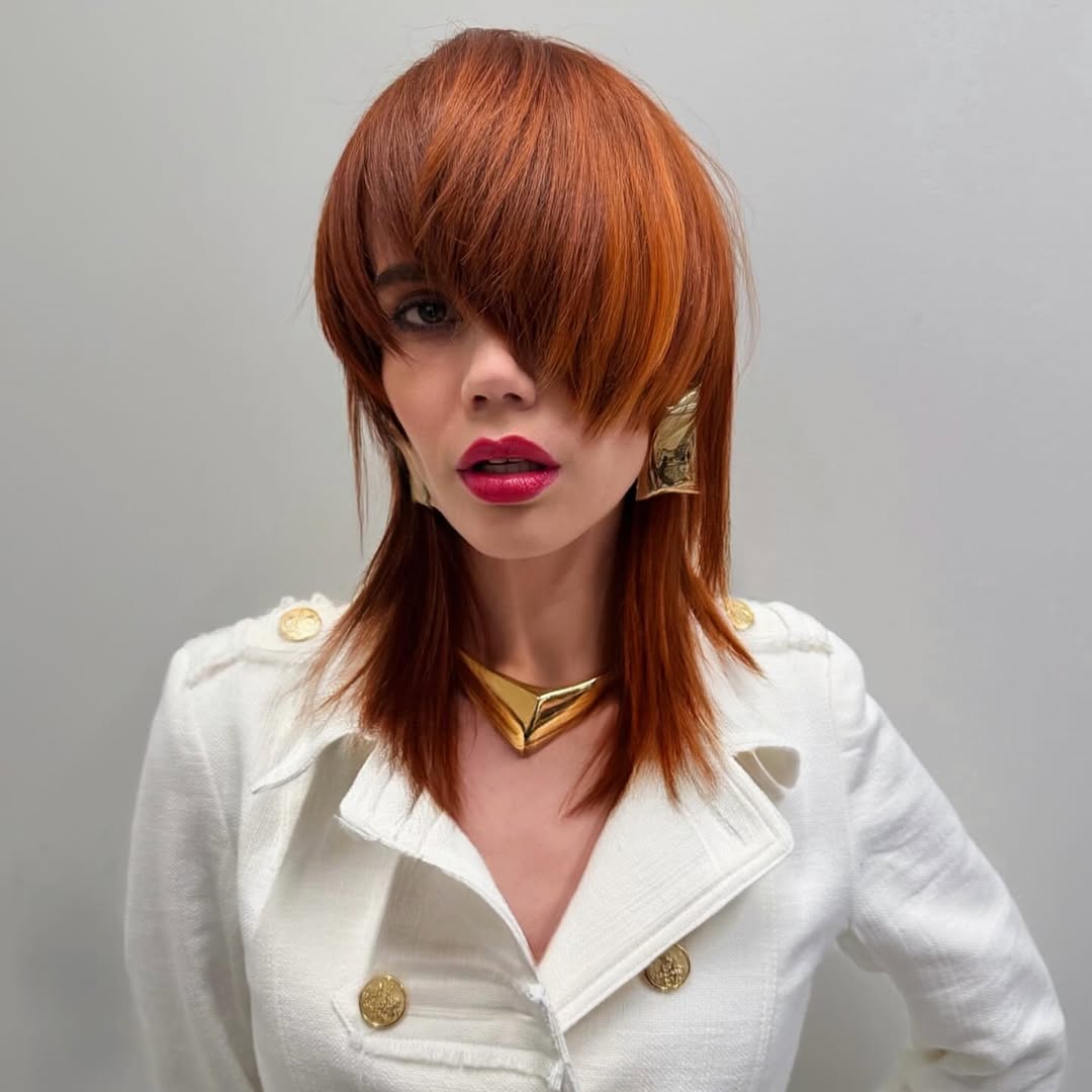 textured summer haircuts for medium hair 2026 Edgy Choppy Layered Shag with Statement Bangs