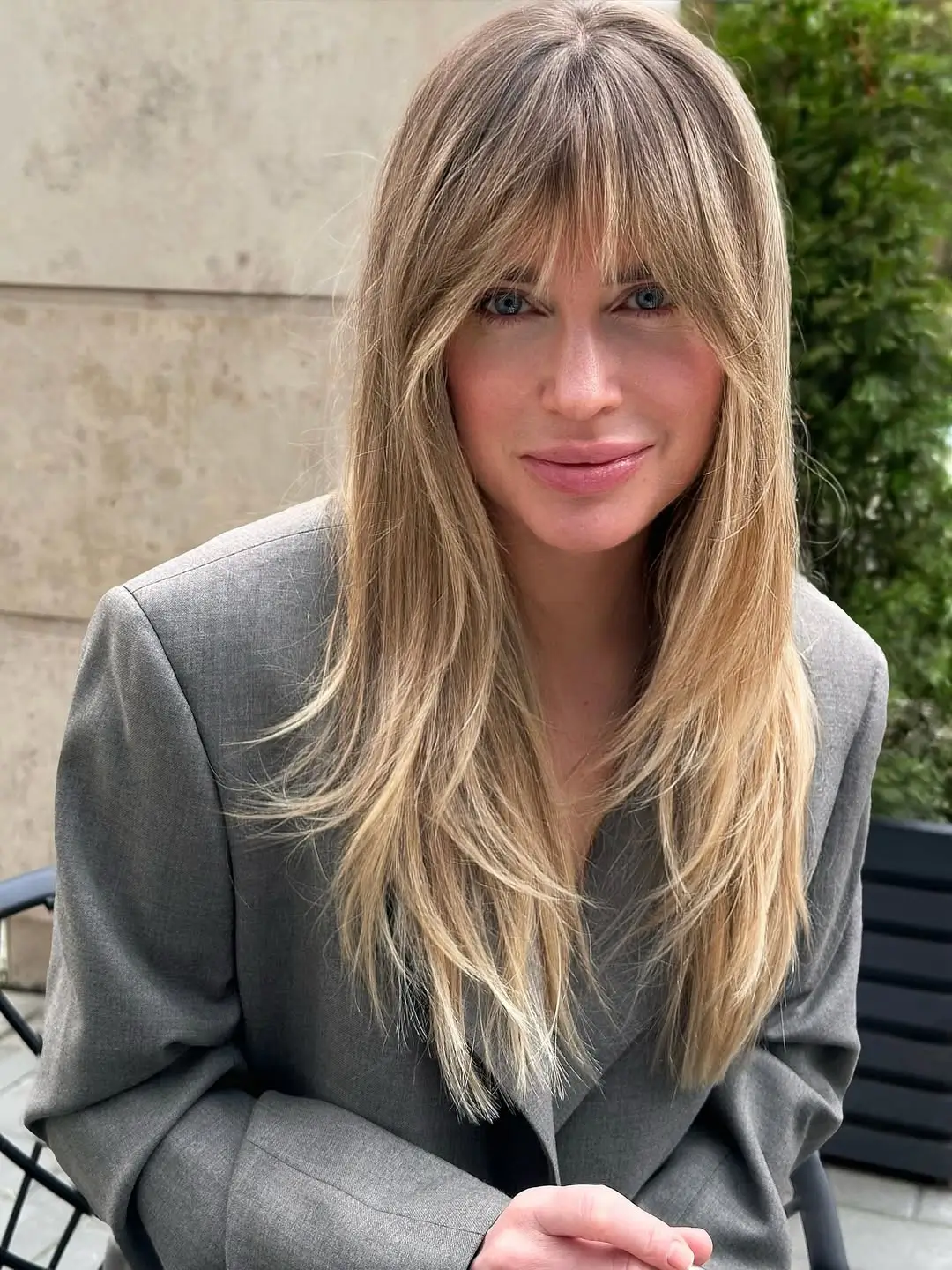 textured summer haircuts for thin fine hair 2026 Feathered medium long layers with light fringe