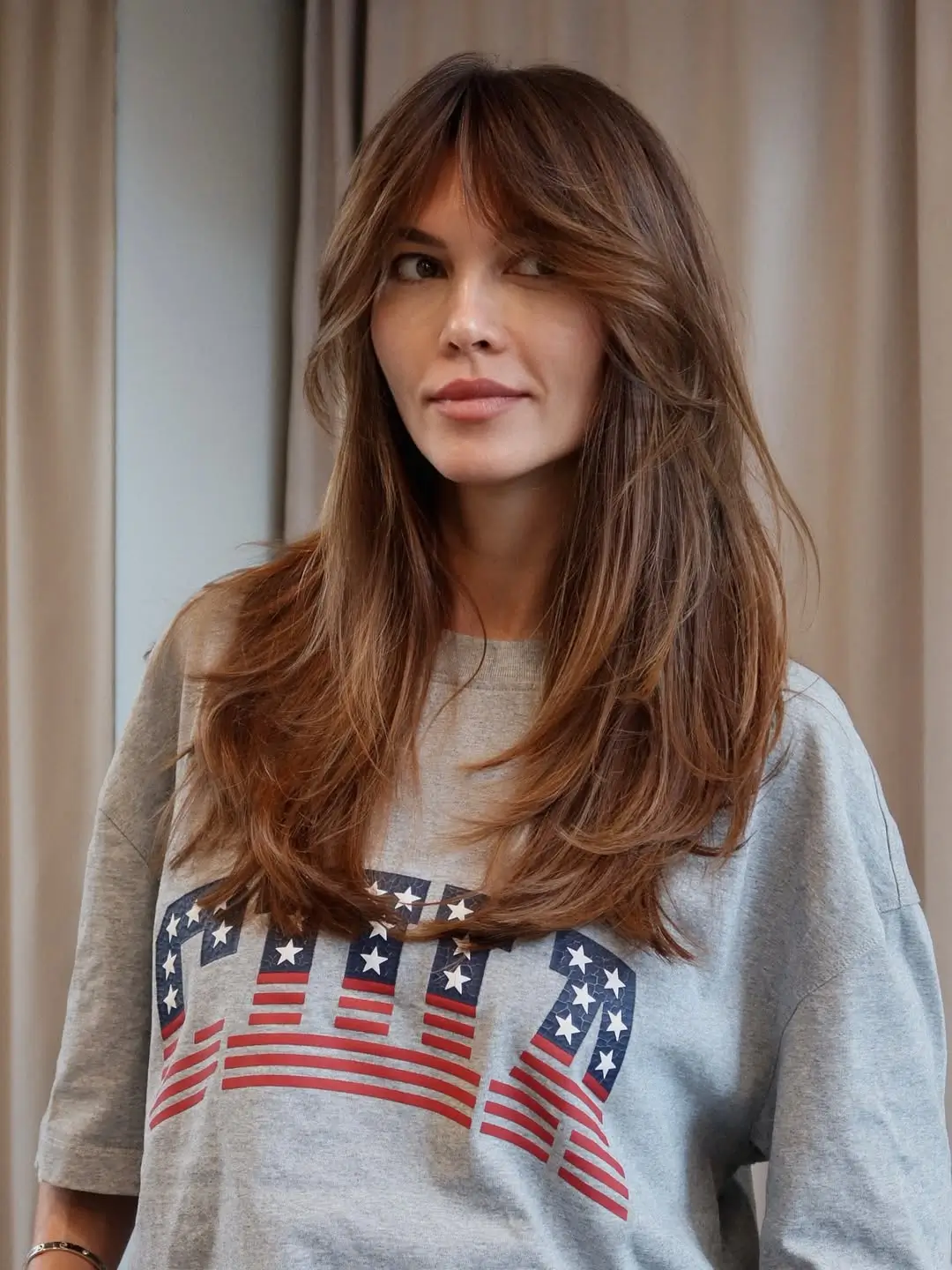 textured summer haircuts for thin fine hair 2026 Soft layered brunette with natural volume