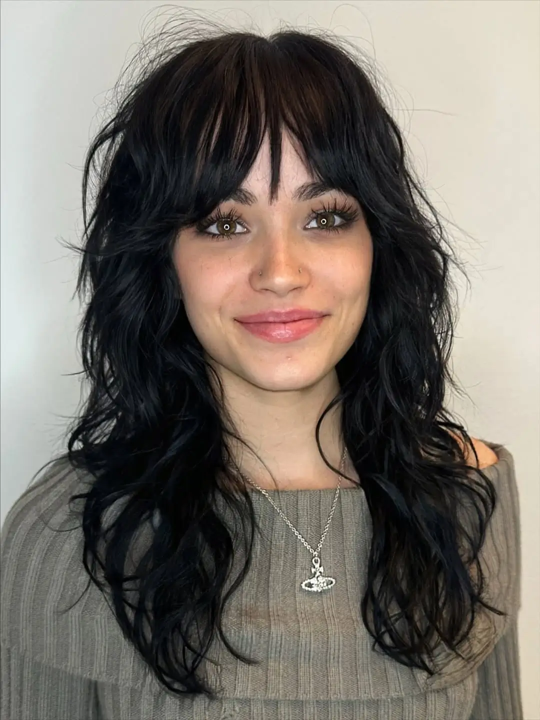 textured summer shag haircut 2026 Soft Black Shag With Airy Curtain Bangs