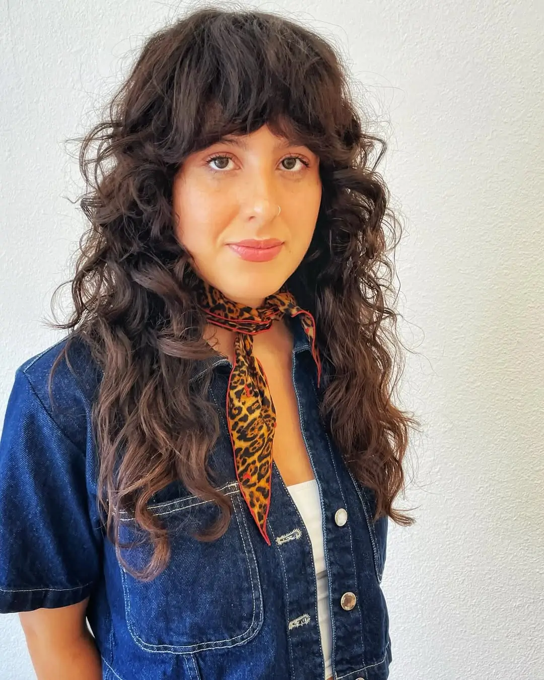 textured summer shag haircut 2026 Long Voluminous Curly Shag With Full Fringe