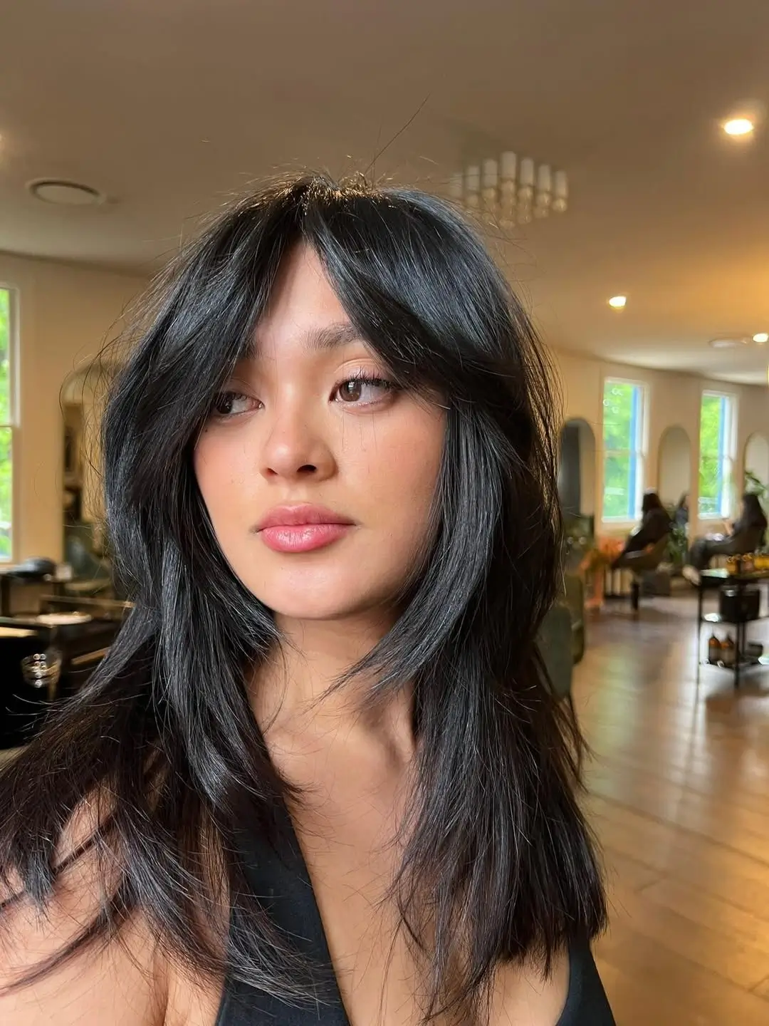 textured summer shag haircut 2026 Sleek Black Mid Length Shag With Polished Layers