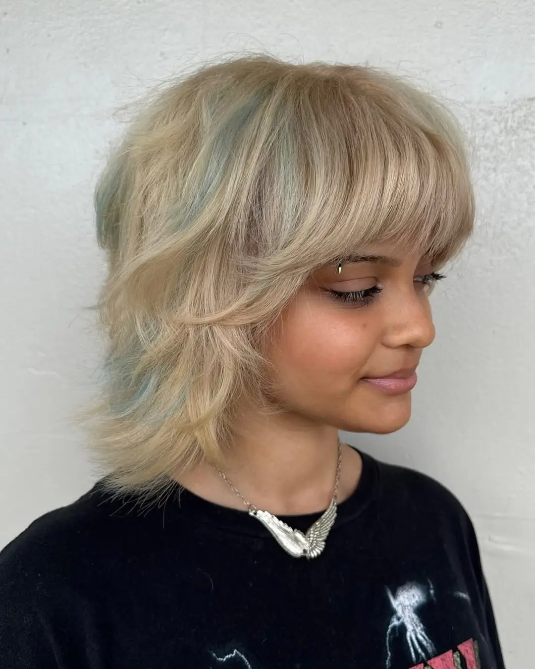 textured summer shag haircut 2026 Soft Blonde Short Shag With Feathered Bangs