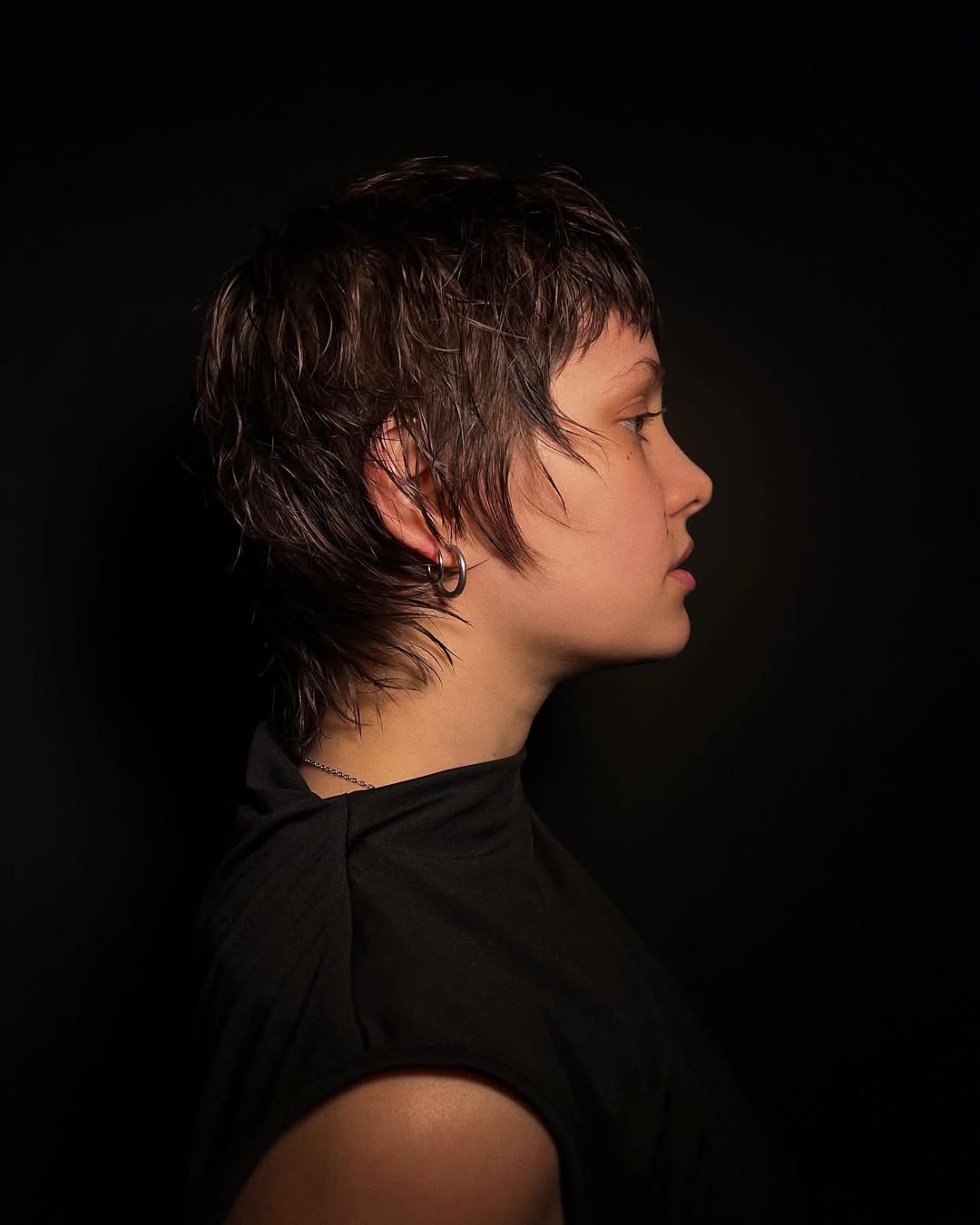 textured summer short haircuts 2026 Wet Look Layered Pixie With Subtle Edge