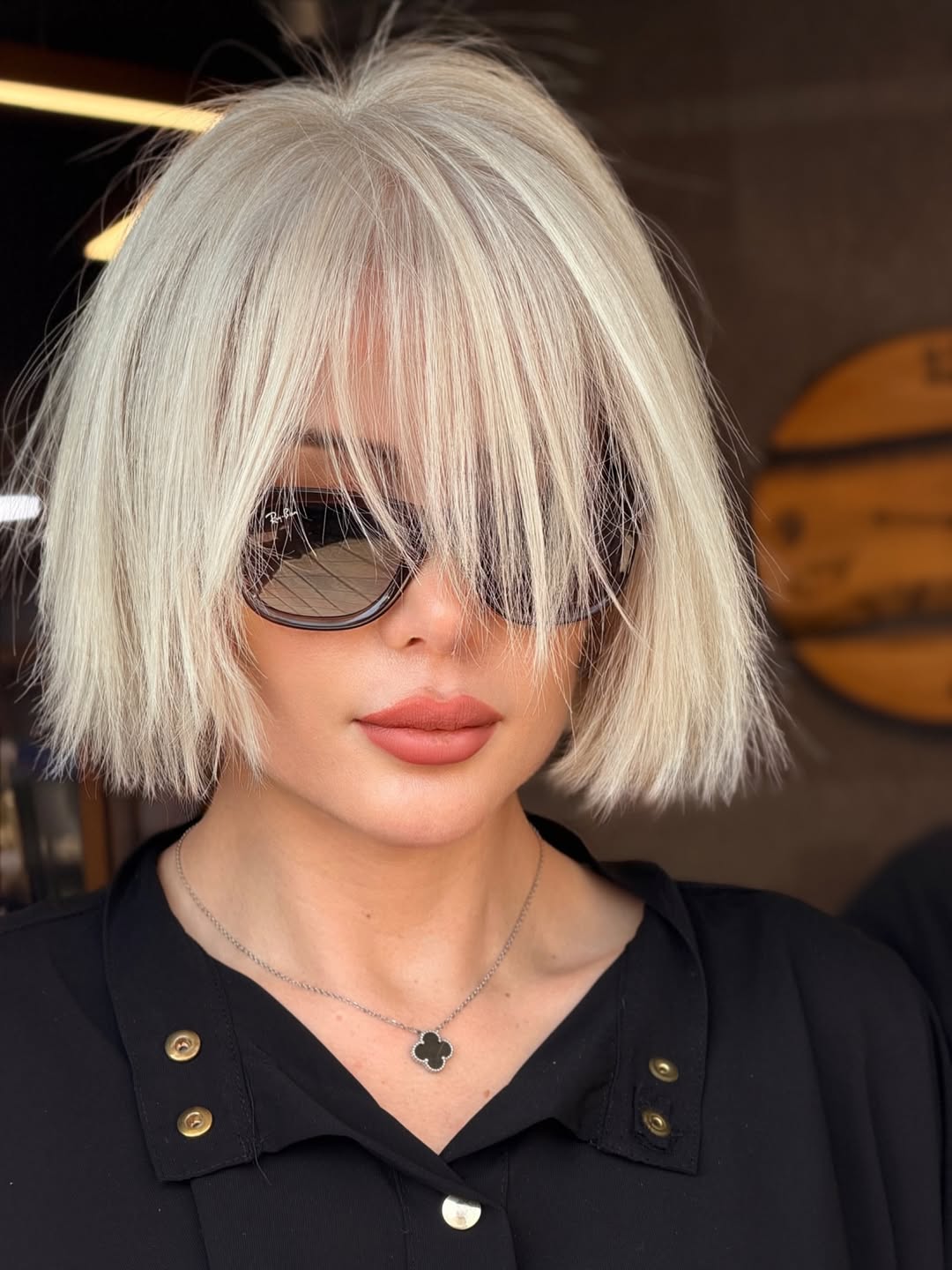 textured summer short haircuts 2026 Platinum Shaggy Bob With Full Textured Bangs