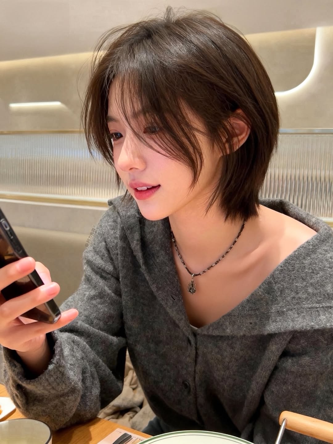 textured summer short haircuts 2026 Soft Layered Bob With Airy Face Framing