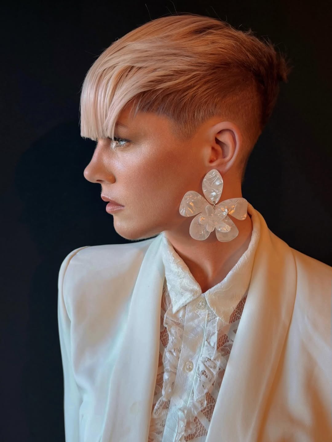 textured summer short haircuts 2026 Sharp Undercut Pixie With Dramatic Side Bangs