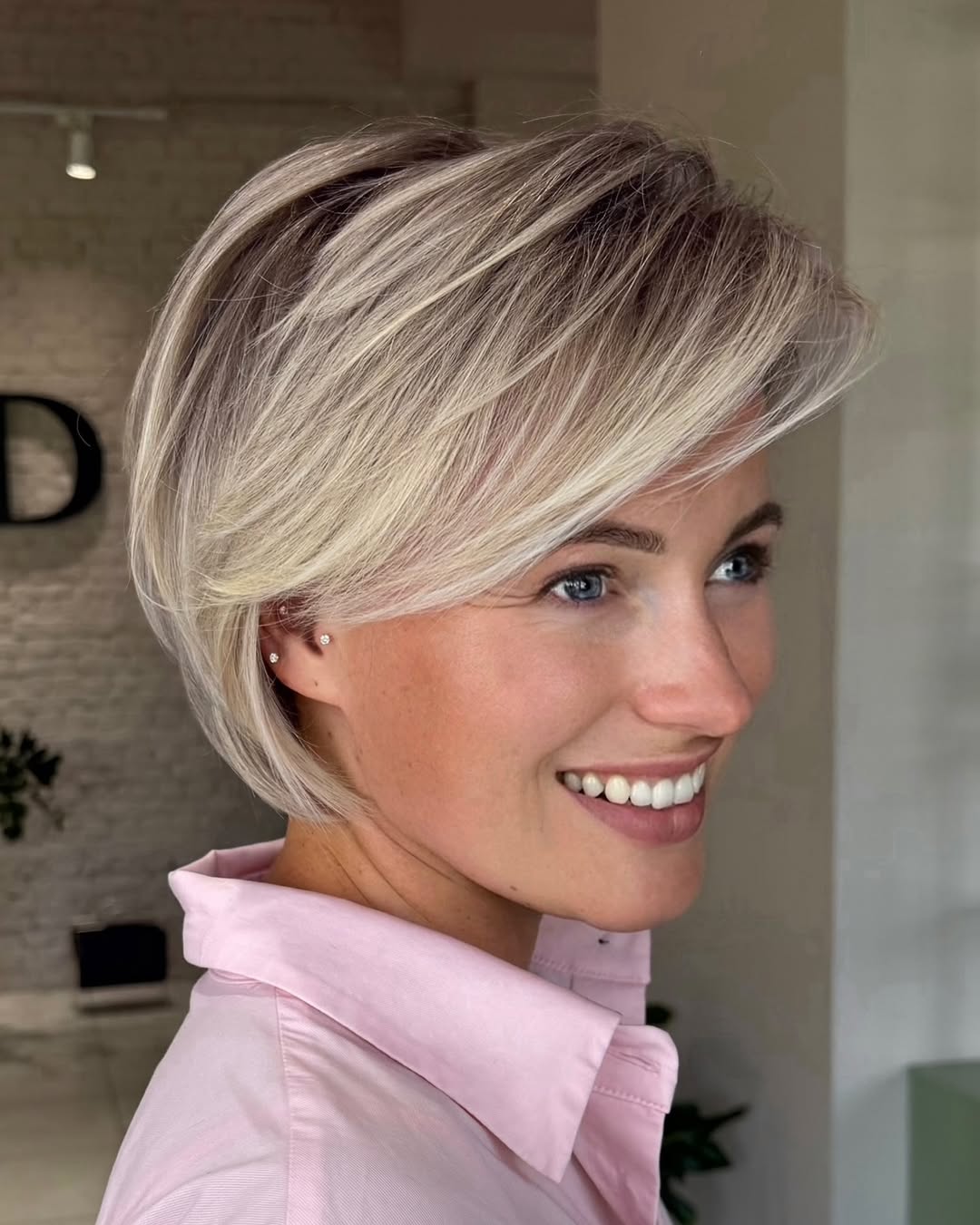 textured summer short haircuts 2026 Sleek Side Swept Blonde Bob