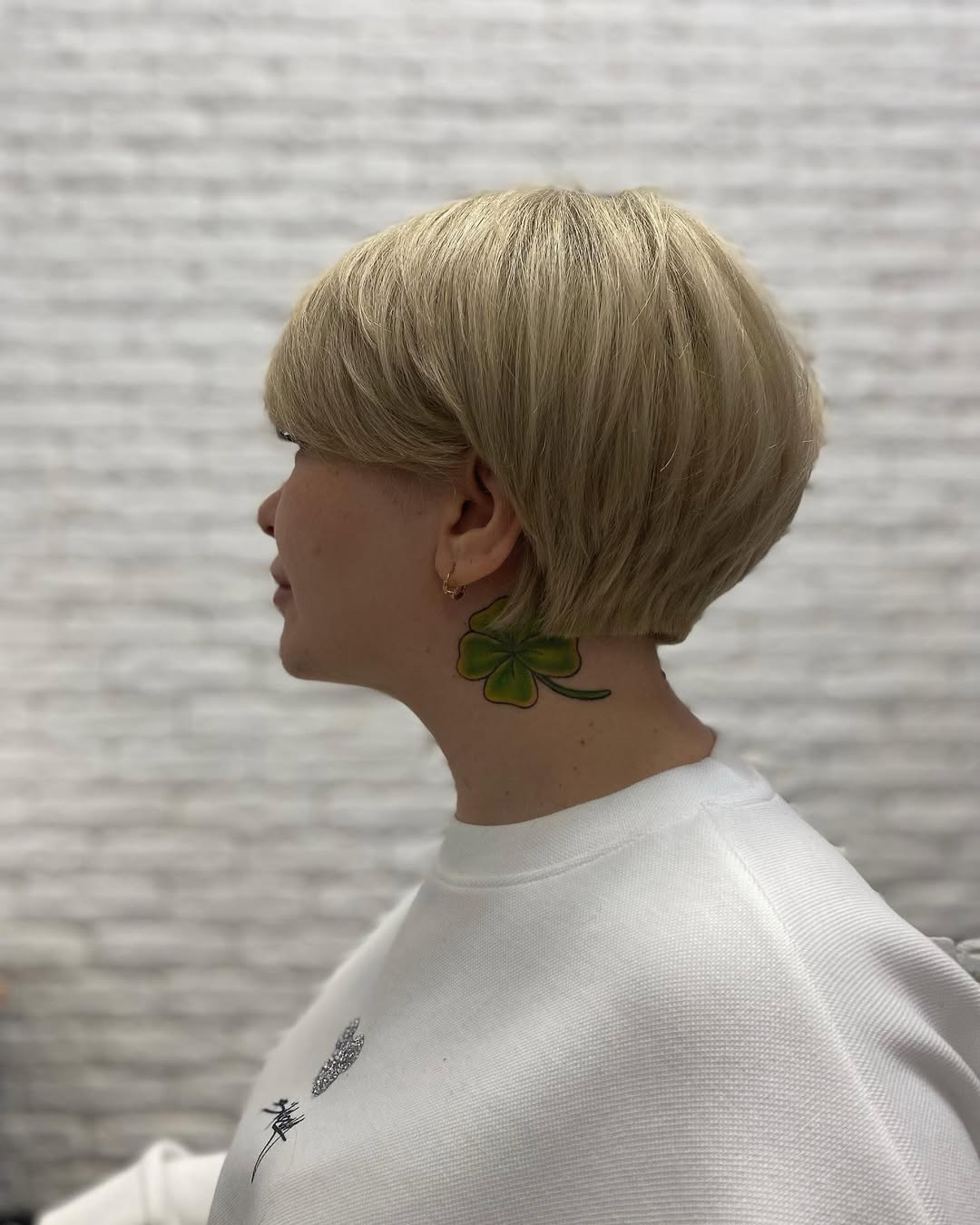 textured summer short haircuts 2026 Classic Rounded Blonde Bob With Soft Full Bangs