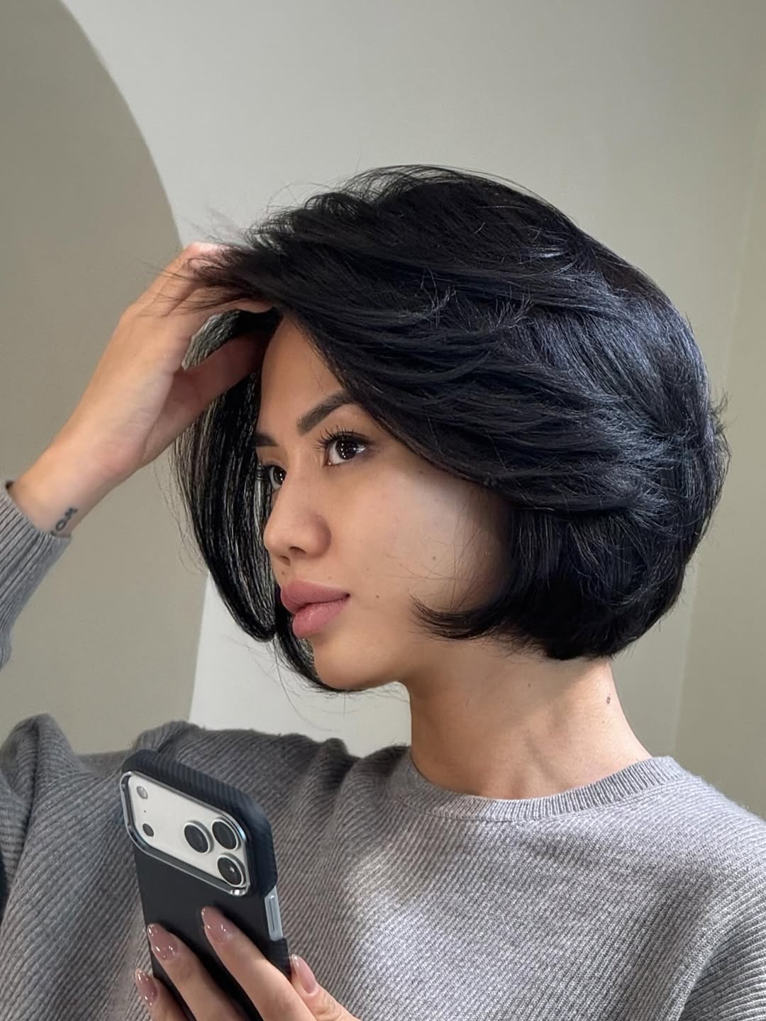 textured summer short haircuts 2026 Voluminous Sleek Bob With Side Lift