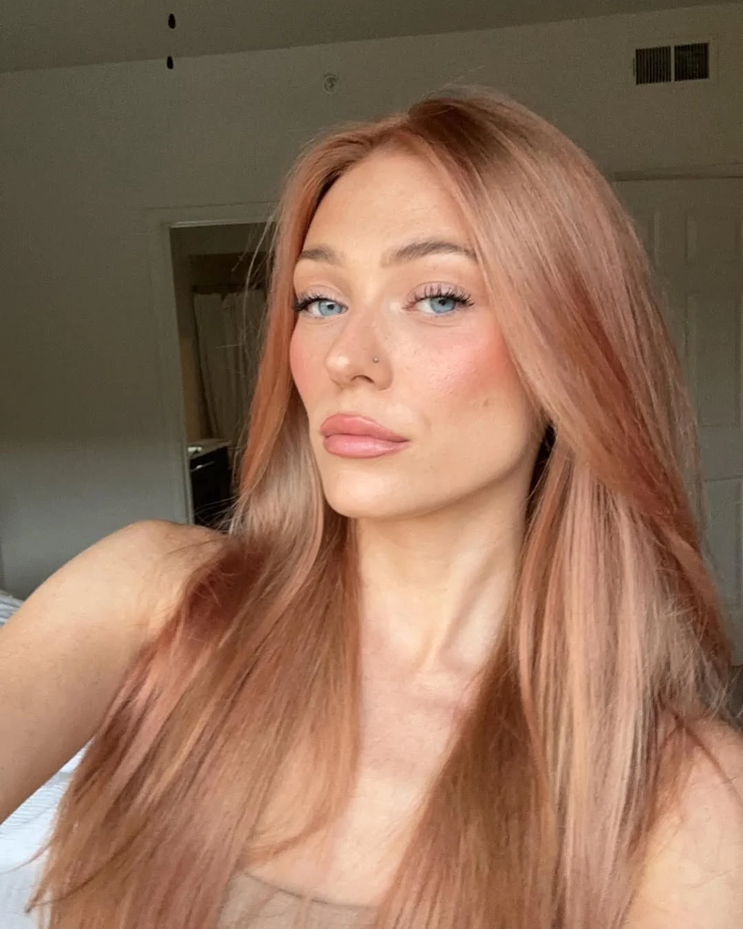 trendy summer hair color ideas 2026 Soft Peach Blonde With Barely There Rosy Warmth