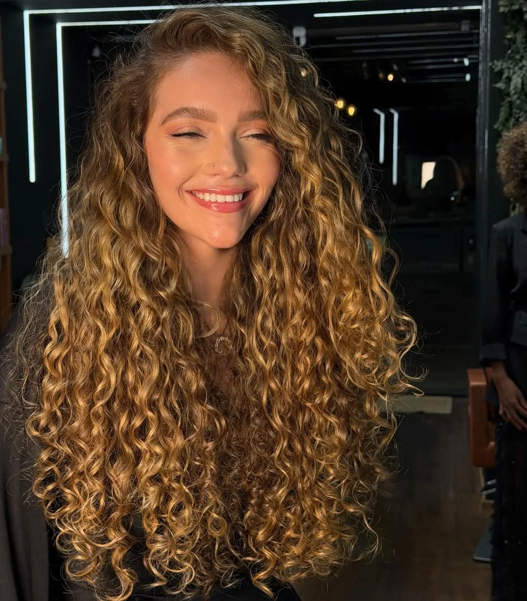 trendy summer hair color ideas 2026 Golden Spiral Curls With Dimensional Brunette Balayage