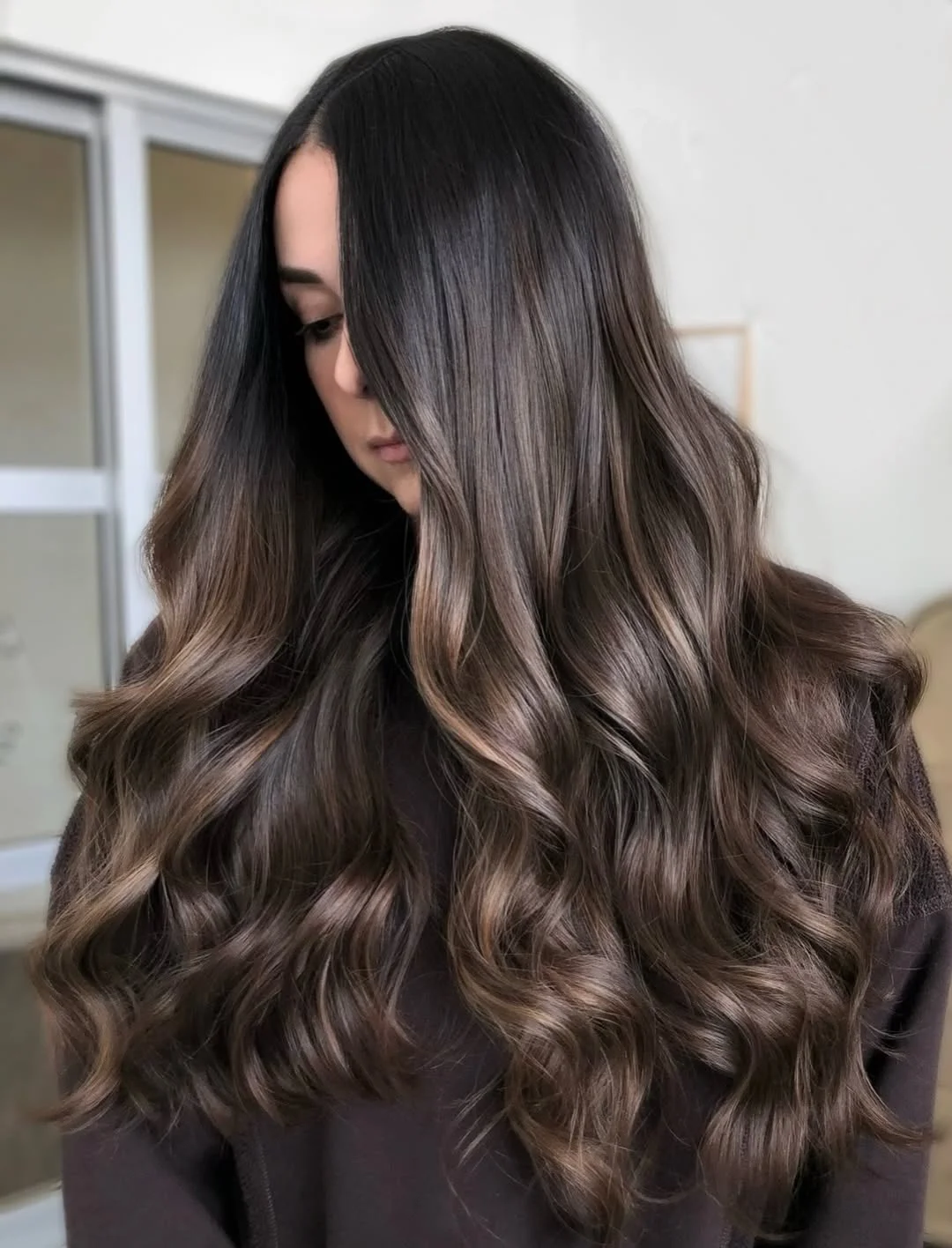 warm summer hair color ideas for brunettes 2026 Smoky Cocoa Brunette With Soft Dimensional Waves