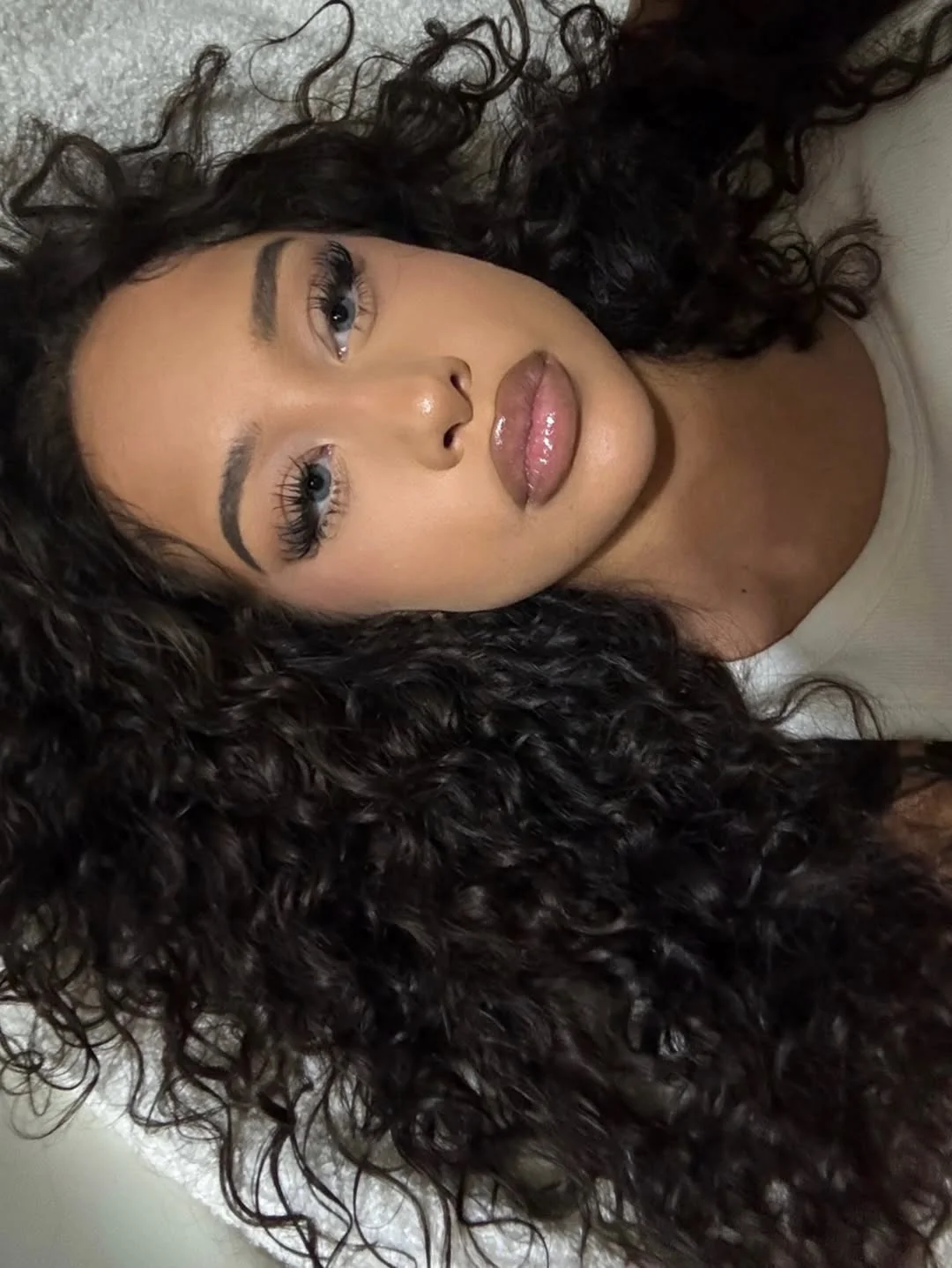 warm summer hair color ideas for brunettes 2026 Rich Curly Brunette With Dimensional Summer Warmth