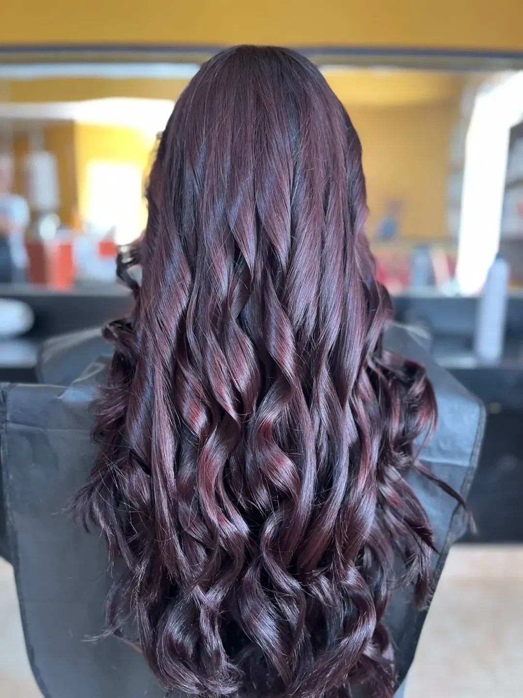 warm summer hair color ideas for brunettes 2026 Black Cherry Curls With Cool Plum Dimension
