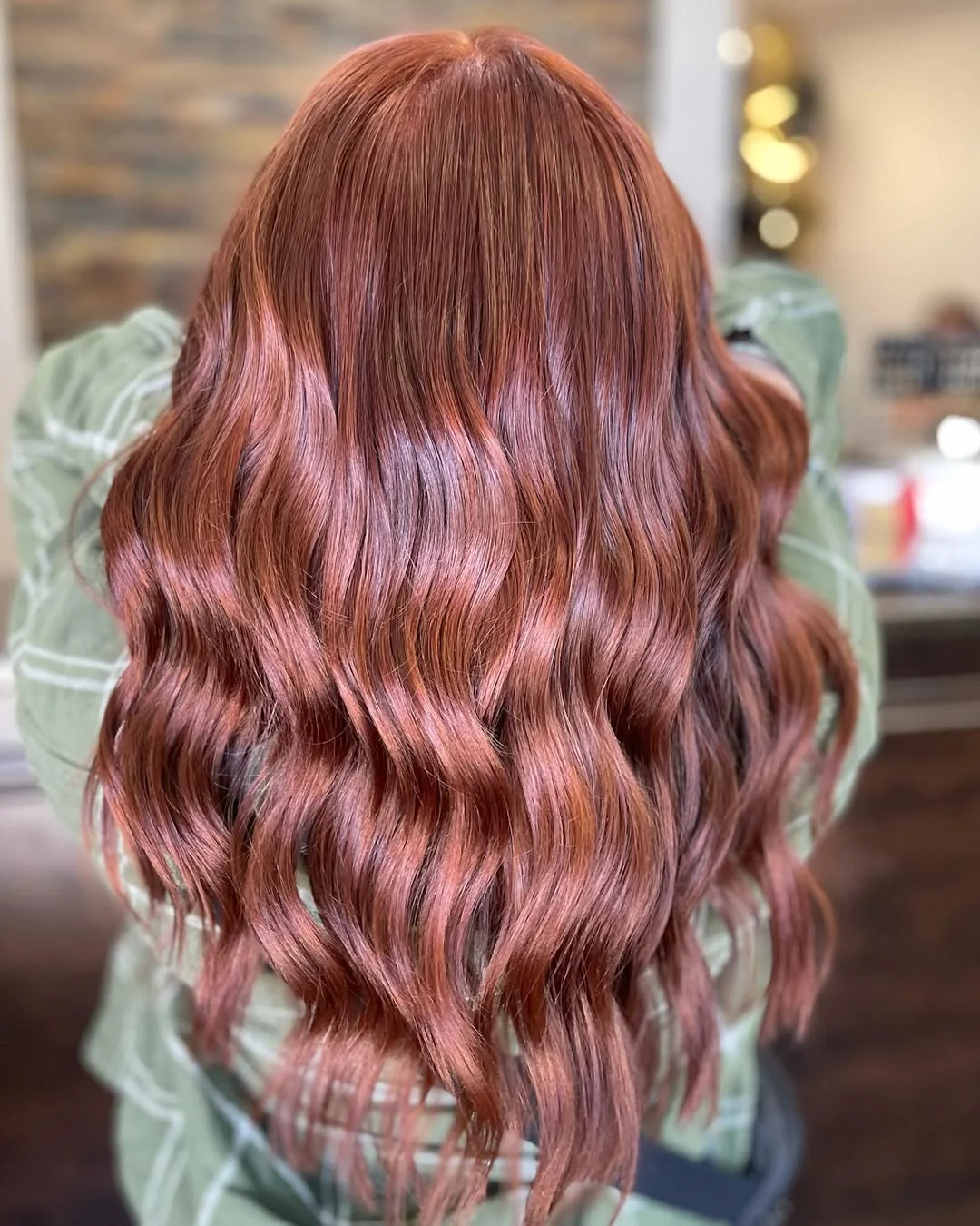 bold summer cowgirl copper hair color 2026 glossy red polished waves