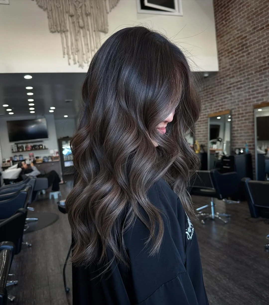 19 cool-toned summer mushroom brown hair color 2026 Deep Smokey Brunette With Glossy Cool Waves