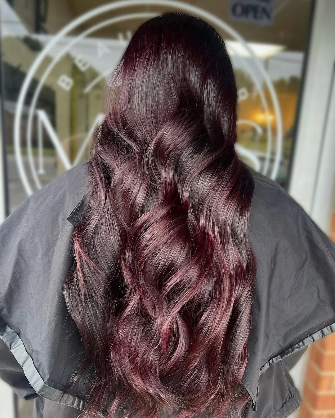 deep summer velvet burgundy hair color 2026 Soft Mocha Burgundy Waves With Hidden Violet Undertones