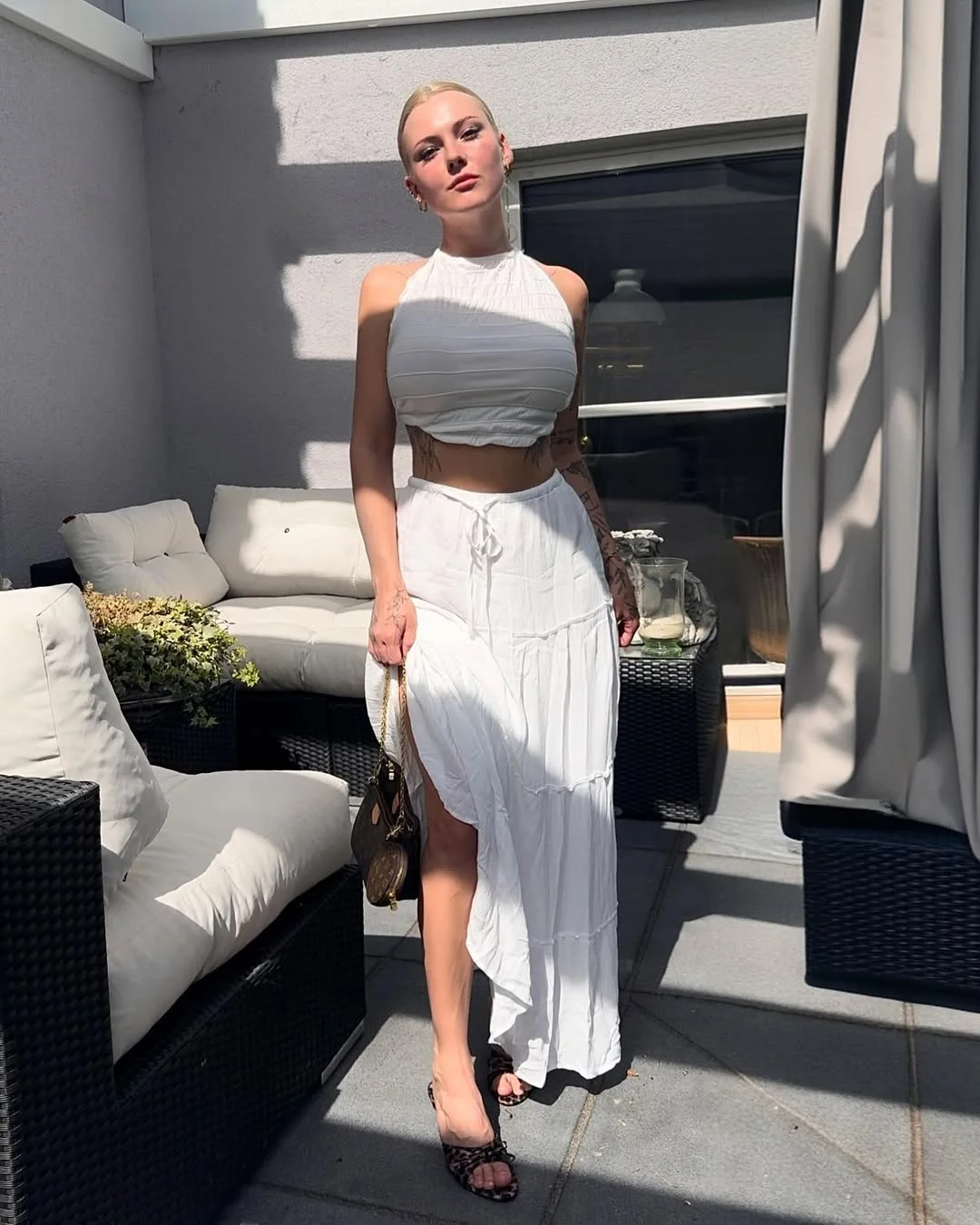 24 June Outfits Ideas for women 2026 Flowing White Skirts And Halter Tops Capture Quiet Summer Elegance